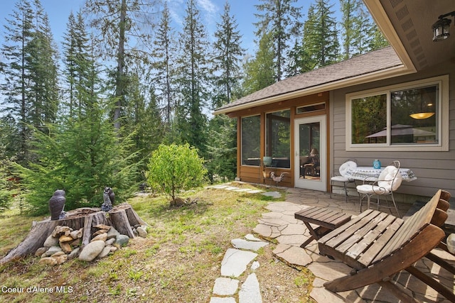 304 Hagman Rd, Nordman, ID 83848 - view of yard featuring a patio and a sunroom