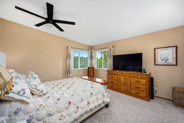 bedroom featuring carpet, ceiling fan, and vaulted ceiling