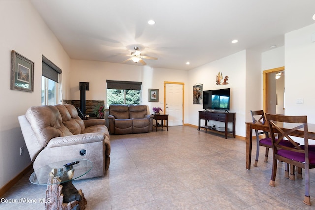 108 Ironwood Dr, Blanchard, ID 83804 - living area featuring a wood stove, a ceiling fan, recessed lighting, light tile patterned floors, and baseboards