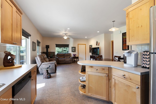 108 Ironwood Dr, Blanchard, ID 83804 - kitchen featuring light brown cabinetry, stainless steel dishwasher, a peninsula, plenty of natural light, and recessed lighting