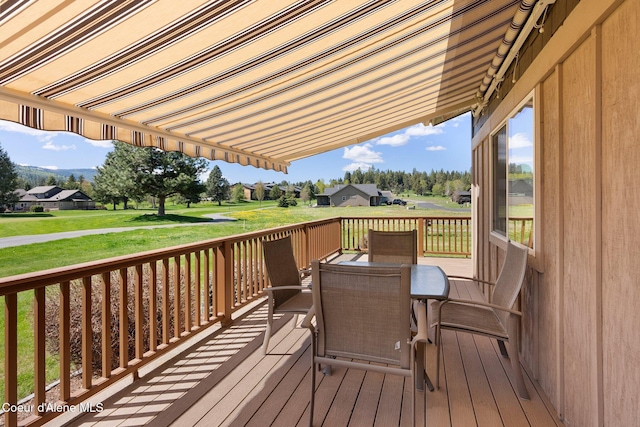 108 Ironwood Dr, Blanchard, ID 83804 - deck featuring outdoor dining space, a yard, and a residential view