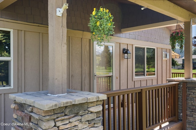 108 Ironwood Dr, Blanchard, ID 83804 - view of exterior entry featuring covered porch and board and batten siding