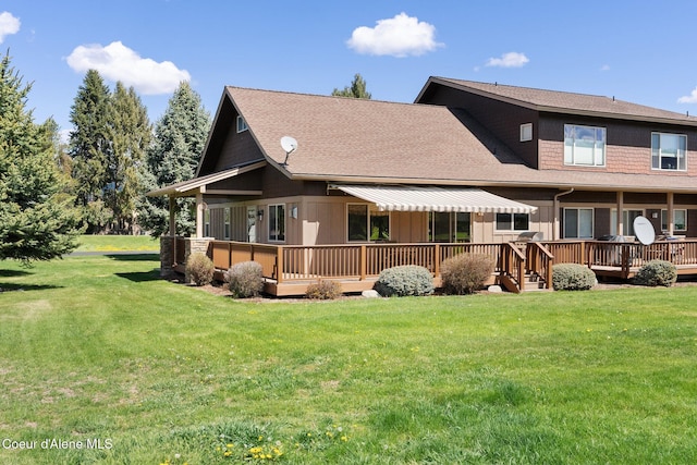 108 Ironwood Dr, Blanchard, ID 83804 - rear view of property with a wooden deck, a lawn, a shingled roof, and board and batten siding