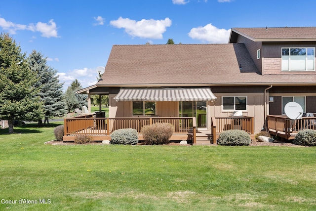108 Ironwood Dr, Blanchard, ID 83804 - rear view of property featuring a wooden deck, a yard, and a shingled roof