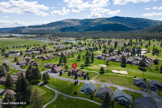 108 Ironwood Dr, Blanchard, ID 83804 - aerial perspective of suburban area featuring a water and mountain view, a heavily wooded area, and a golf course