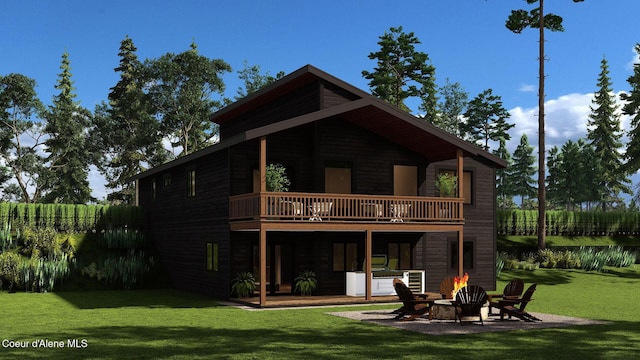 back of property featuring an outdoor fire pit, a yard, a patio area, and a balcony