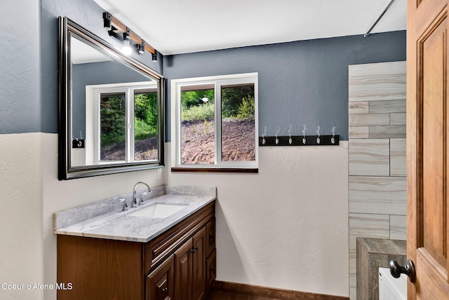 12251 W Blessing Hill Rd, Post Falls, ID 83854 - bathroom with vanity and a textured wall