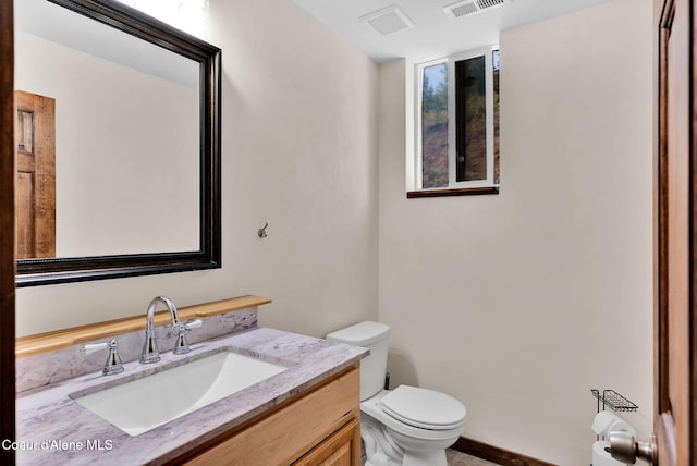12251 W Blessing Hill Rd, Post Falls, ID 83854 - bathroom with toilet and vanity
