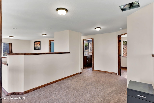 12251 W Blessing Hill Rd, Post Falls, ID 83854 - empty room with carpet, baseboards, and healthy amount of natural light