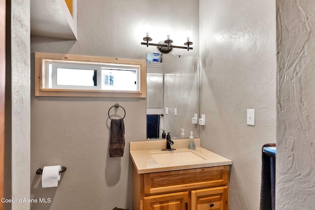 12251 W Blessing Hill Rd, Post Falls, ID 83854 - bathroom with vanity and a textured wall