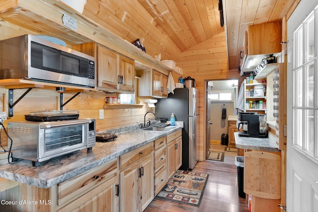 12251 W Blessing Hill Rd, Post Falls, ID 83854 - kitchen featuring stainless steel appliances, a sink, wood ceiling, light wood-style floors, and lofted ceiling