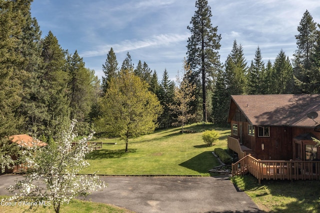 249 Gun Club Rd, Sagle, ID 83860 - view of grassy yard with a deck
