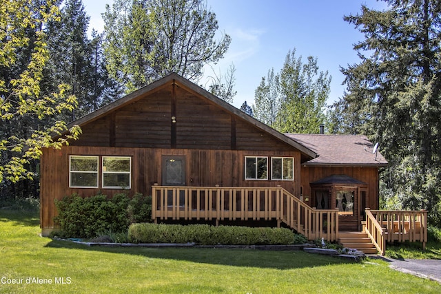 249 Gun Club Rd, Sagle, ID 83860 - back of property with a deck, a yard, and a shingled roof