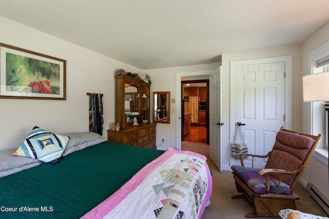 249 Gun Club Rd, Sagle, ID 83860 - carpeted bedroom featuring a baseboard heating unit