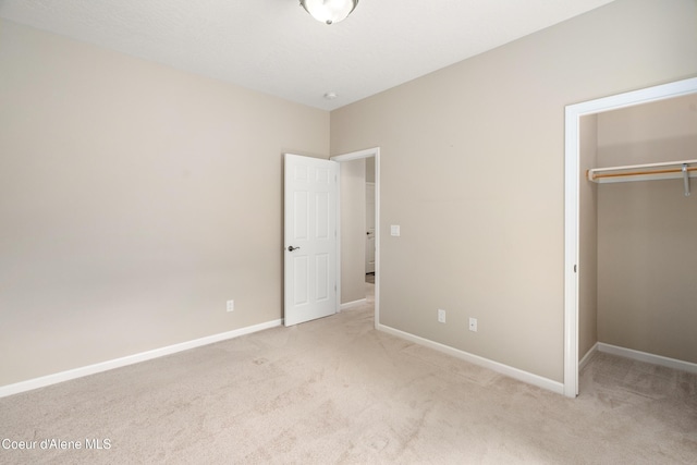 3253 W Magistrate Loop, Hayden, ID 83835 - unfurnished bedroom featuring carpet floors, a closet, a spacious closet, and baseboards