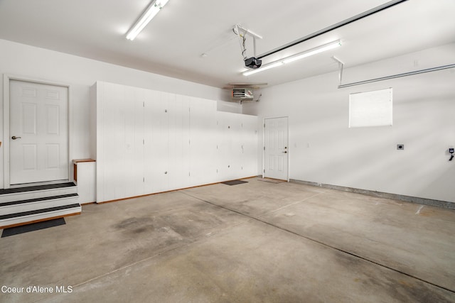 3253 W Magistrate Loop, Hayden, ID 83835 - garage with a garage door opener and baseboards