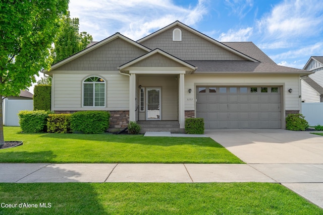 3253 W Magistrate Loop, Hayden, ID 83835 - craftsman inspired home with a garage, concrete driveway, and stone siding