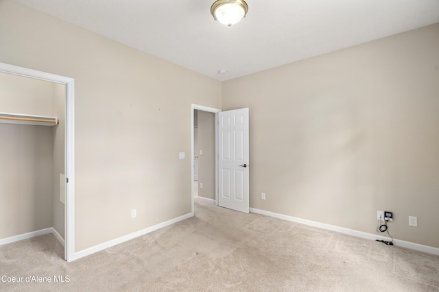 3253 W Magistrate Loop, Hayden, ID 83835 - unfurnished bedroom with light colored carpet, a closet, baseboards, and a spacious closet