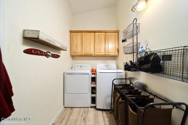 4411 N Campbell Rd, Otis Orchards, WA 99027 - clothes washing area featuring washer and dryer, light wood-style floors, and cabinet space