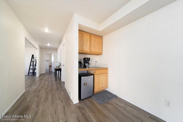 4411 N Campbell Rd, Otis Orchards, WA 99027 - kitchen featuring fridge, dark wood-type flooring, a sink, recessed lighting, and baseboards