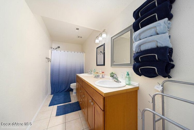 4411 N Campbell Rd, Otis Orchards, WA 99027 - bathroom with tile patterned floors, vanity, toilet, curtained shower, and baseboards