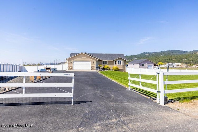 4411 N Campbell Rd, Otis Orchards, WA 99027 - view of front of house featuring driveway and a garage