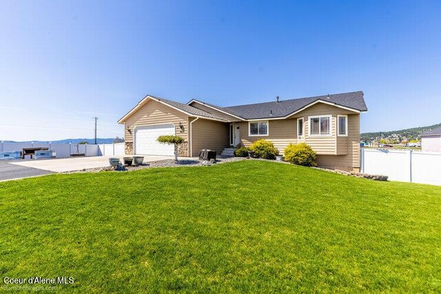 4411 N Campbell Rd, Otis Orchards, WA 99027 - ranch-style house featuring an attached garage and concrete driveway