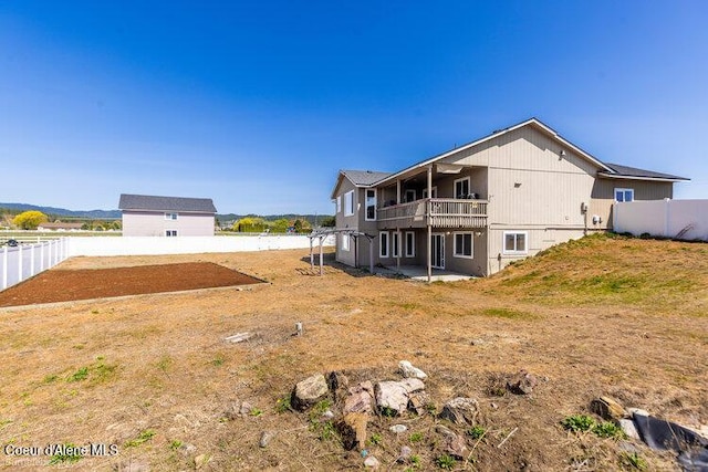 4411 N Campbell Rd, Otis Orchards, WA 99027 - rear view of house with fence and a patio area