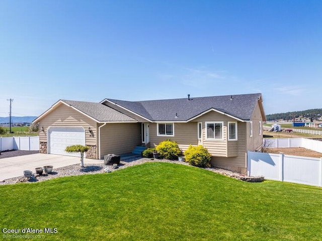 4411 N Campbell Rd, Otis Orchards, WA 99027 - ranch-style house with an attached garage, concrete driveway, and a shingled roof