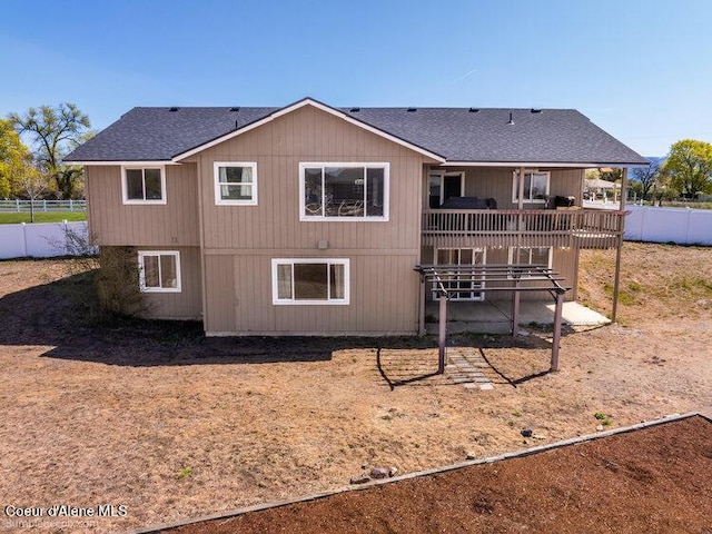 4411 N Campbell Rd, Otis Orchards, WA 99027 - rear view of property featuring fence, a wooden deck, and roof with shingles