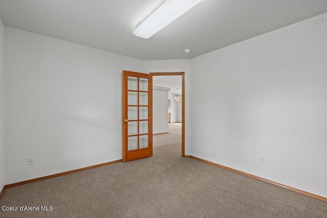 1100 E Autumn Crest Loop, Post Falls, ID 83854 - carpeted spare room featuring baseboards