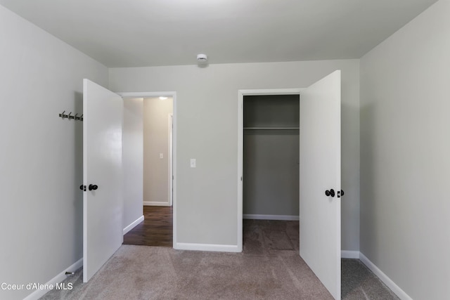 1223 W Superior, Sandpoint, ID 83864 - unfurnished bedroom featuring carpet, a spacious closet, a closet, and baseboards