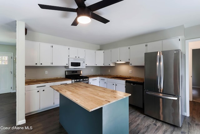1223 W Superior, Sandpoint, ID 83864 - kitchen with stainless steel appliances, wood counters, dark wood-type flooring, and a ceiling fan