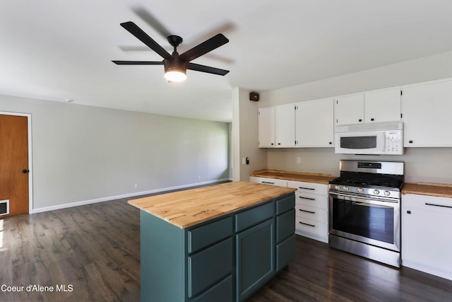 1223 W Superior, Sandpoint, ID 83864 - kitchen featuring white microwave, gas stove, wooden counters, white cabinetry, and ceiling fan
