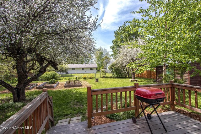 1223 W Superior, Sandpoint, ID 83864 - wooden deck with a vegetable garden and area for grilling