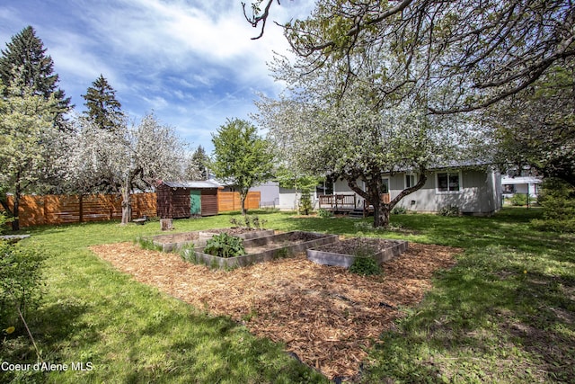 1223 W Superior, Sandpoint, ID 83864 - view of yard featuring a storage shed, an outdoor structure, and a vegetable garden