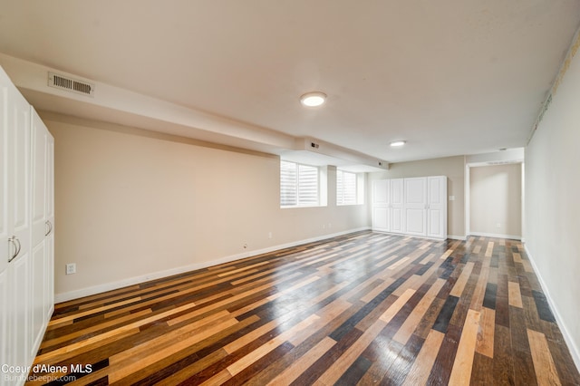 30603 N Riffle Rd, Spirit Lake, ID 83869 - unfurnished bedroom featuring dark wood-type flooring, baseboards, and a closet