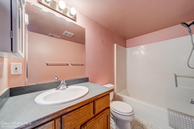 30603 N Riffle Rd, Spirit Lake, ID 83869 - bathroom featuring toilet, vanity, a textured wall, and shower / bathtub combination