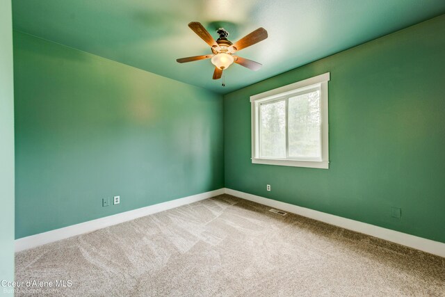 30603 N Riffle Rd, Spirit Lake, ID 83869 - carpeted empty room with ceiling fan and baseboards