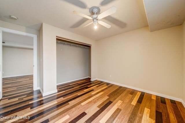 30603 N Riffle Rd, Spirit Lake, ID 83869 - unfurnished bedroom with wood finished floors, a closet, and baseboards