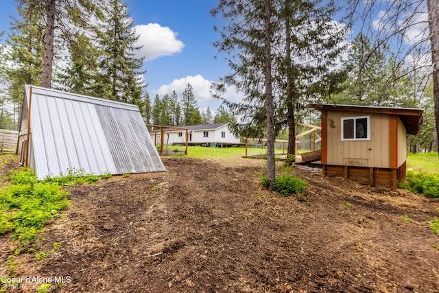 30603 N Riffle Rd, Spirit Lake, ID 83869 - view of yard featuring an outbuilding and exterior structure