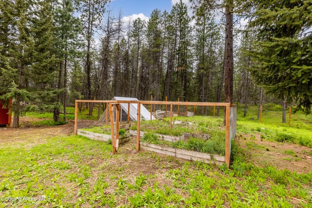 30603 N Riffle Rd, Spirit Lake, ID 83869 - view of yard with a vegetable garden