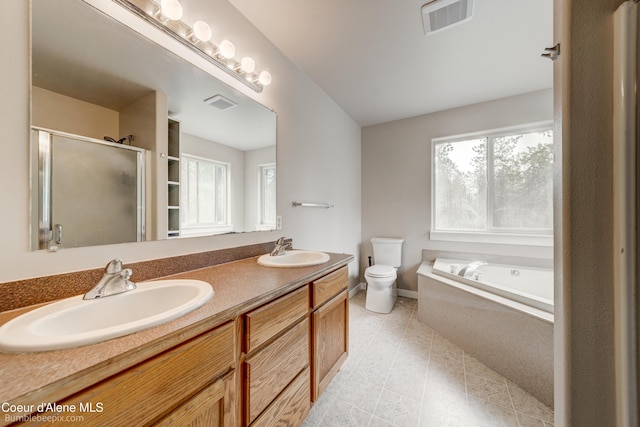 30603 N Riffle Rd, Spirit Lake, ID 83869 - bathroom featuring plenty of natural light, toilet, a shower stall, and a bath
