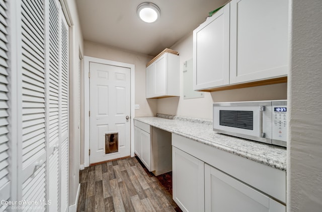 30603 N Riffle Rd, Spirit Lake, ID 83869 - laundry area featuring dark wood-style flooring