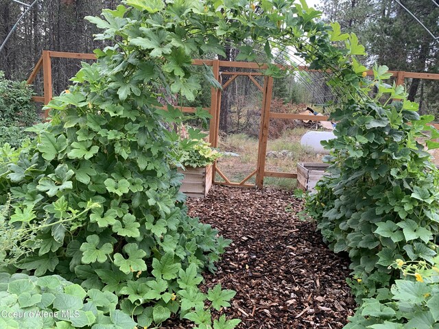 30603 N Riffle Rd, Spirit Lake, ID 83869 - view of yard featuring fence and a garden