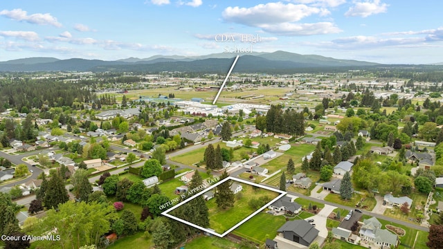 aerial view of residential area featuring mountains and property boundaries highlighted