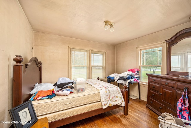 bedroom featuring wood finished floors
