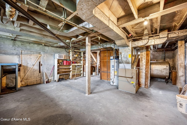 unfinished below grade area with heating fuel, water heater, and heating unit