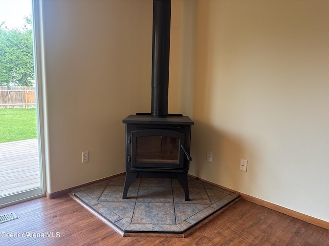 1205 Kinnikinnik Ave, Sandpoint, ID 83864 - detailed view of a wood stove and wood finished floors