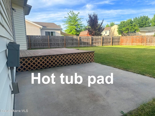 1205 Kinnikinnik Ave, Sandpoint, ID 83864 - fenced backyard featuring a wooden deck and a patio